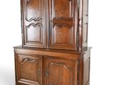an image of a wooden cabinet with two doors and drawers