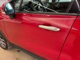 a red car that is parked in a garage