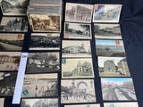 a lot of old postcards that are on the table