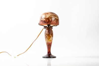 a lamp that is sitting on a table with a cord attached to it