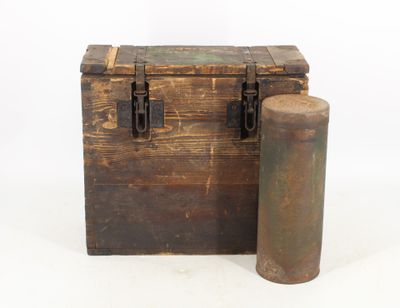 an old wooden chest and a metal cylinder on a white background