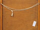 a close up of a wooden frame with a rope hanging from it