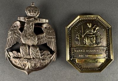 an image of a silver medal with an eagle on it and a medal with a crown on it