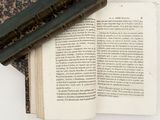 an open book with a bookmark laying on top of it