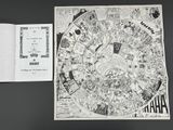 an open book with a drawing of a map on it