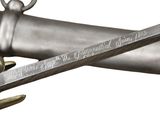 a close up of a pair of swords with a quote on it