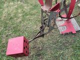 a metal object that is sitting in the grass