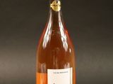 a bottle of wine that is sitting on a table