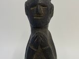 statue of a man with a hat on his head and a hat on his head