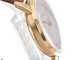 an image of a close up of a watch on a white surface