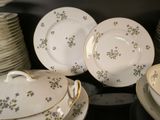 many plates and bowls that are stacked on top of each other