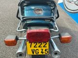 a motorcycle that is parked on the side of the road