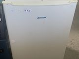 a white refrigerator sitting next to a blue refrigerator