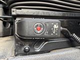 a close up of a car ' s dashboard with a remote control