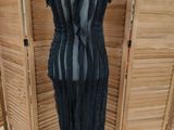 a mannequin dress with black and grey stripes on it