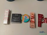 various makeup products laid out on a table