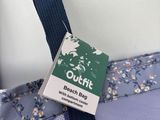 a blue bag with a tag on it that says o - fit