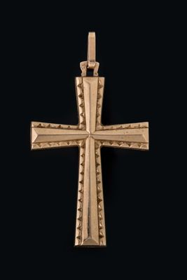 une image représentant une croix dorée sur fond noir