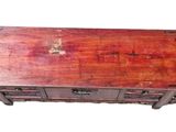 a wooden shelf with a drawer on top of it