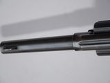 an image of a close up of a gun on a white surface