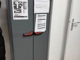 a refrigerator that has a lot of papers on it