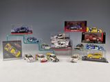a group of toy cars are displayed in a display case