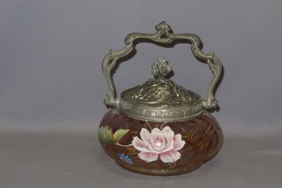 a small vase with a flower on it on a table