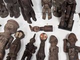 a lot of wooden figurines sitting on a table