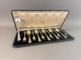 a case with silverware inside of it on a table
