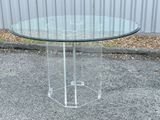 a glass table with a glass top on the street