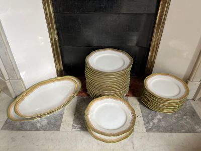 a lot of plates that are sitting on the floor