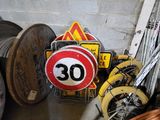 a pile of wires and a sign on the floor