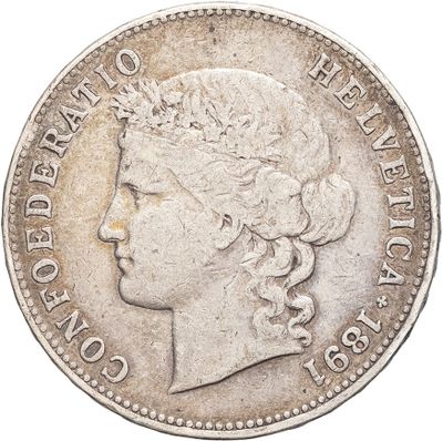 a close up of a coin with a woman ' s head on it