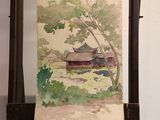 a painting of a house on a easel with a tree in the foreground