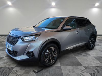 a silver suv parked on a checkered floor in a garage