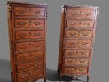 pair of antique chest of drawers with ornate carvings on the sides