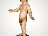 an image of a statue of a baby on a pedestal