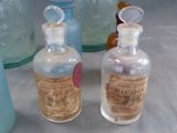 many bottles with different types of medicine on the table