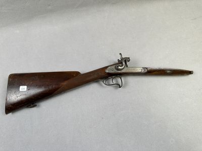 Restant d’une crosse de fusil de chasse, double, à percussio…