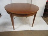 a wooden table with a wooden top on a white rug