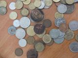 a lot of coins that are on the table