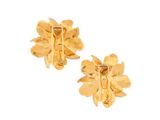 a pair of gold earrings with leaves on them on a white background
