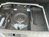 a car trunk with a water tank in it