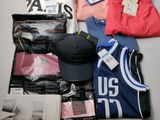 a lot of clothing and a hat on a table