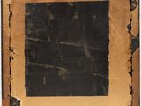 an old picture frame with a black square in the middle