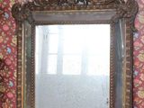 a mirror that is sitting on a table in front of a wall