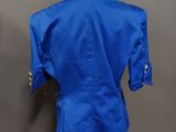 the back of a blue jacket on a mannequin mannequin mannequin mannequin mann