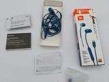 a box of ear buds and a package of ear buds