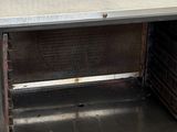 an image of a metal oven with a door open on a pallet