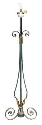 a tall metal pole with a candle holder on top of it